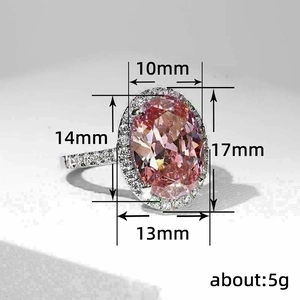 Elegant oval pink zircon ring in silver finish with halo diamonds and size details