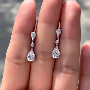 Elegant three-tier silver teardrop earrings with sparkling white zircon gemstones