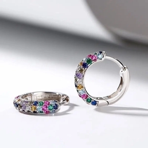 Polished silver earrings featuring vibrant multi-colored zircon stones in a huggie hoop style
