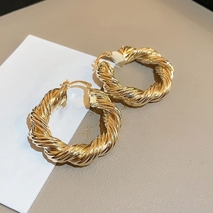 Elegant gold twist hoop earrings with vintage hollow teardrop design for women