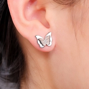 Elegant 3D silver butterfly stud earrings featuring a double-layered textured design