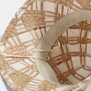 Crossed straw sun hat with woven lattice pattern and adjustable inner sweatband