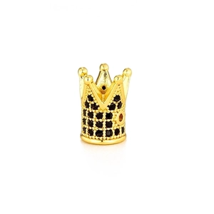 Close-up of golden crown bead with micro-paved black zircons for DIY jewelry making