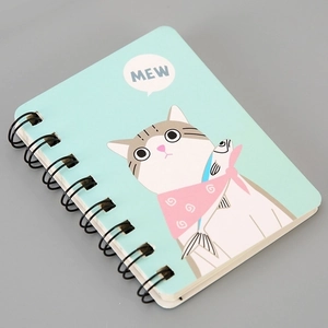Close-up of A7 spiral notebook featuring a cute blue cartoon cat illustration and binding