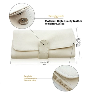 Detail view of cream leather long wallet with magnetic buckle and 23cm length measurement