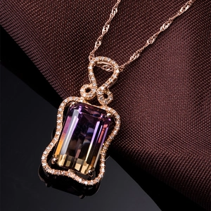 Ametrine necklace in rose gold setting with rectangular crystal on textured fabric
