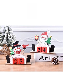 Detail of wooden Christmas countdown calendar with Santa, Snowman and date cubes