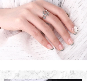 Close-up of star and moon open ring with shimmering pavé cubic zirconia on hand