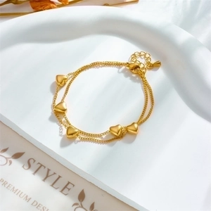 Elegant gold double-layer chain bracelet with five polished 3D heart pendants