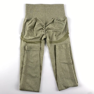 Detailed macro view of olive green seamless scrunch butt leggings with ribbed waistband