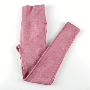 Detail view of pink marl seamless high waisted yoga pants with ribbed compression waistband