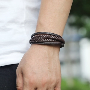 Men's multilayer braided leather bracelet with magnetic clasp on a male wrist