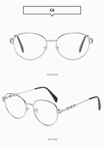 Lunettes de soleil rondes en argent avec pierres bleues marquise sur les branches