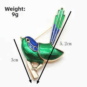 Detailed view of enamel bird brooch with 9g weight and 5.2cm height dimensions