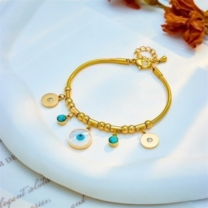Gold snake chain bracelet with evil eye mother of pearl and turquoise circle charms