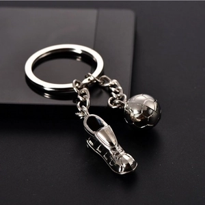 Polished silver metal keychain featuring miniature soccer ball and football shoe pendants