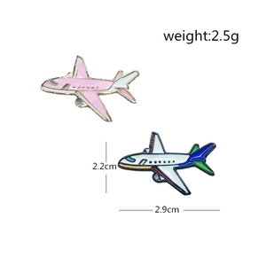 Pink glitter airplane enamel pin and colorful passenger jet brooch in metal with dimensions