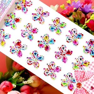 Detailed view of colorful acrylic butterfly rhinestone stickers for DIY facial decoration