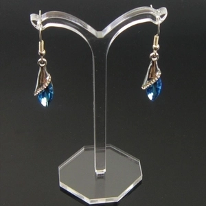 Blue water-drop crystal earrings on Y-shaped acrylic display with silver accents