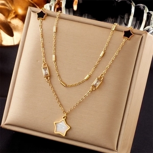 Double-layer gold necklace with black and white star pendants and clear zircon stones