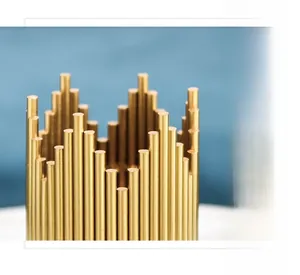 Detail of Nordic luxury gold metal pen holder with wave-shaped irregular cylindrical edges