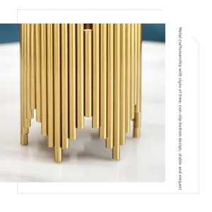 Detail of the golden metal base with anti-slip design and premium craftsmanship