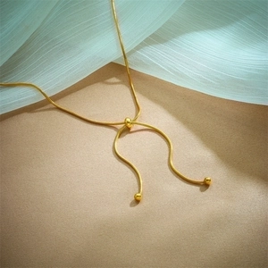 Adjustable gold snake chain necklace with sliding bead and minimalist pull design