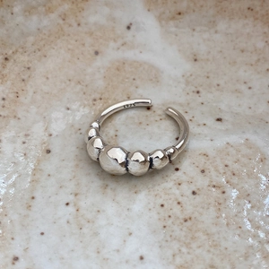 Macro shot of S925 sterling silver stamp on the inner band of an adjustable ring