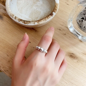 Close-up of 925 sterling silver bubble ring with multi-bead design on female finger