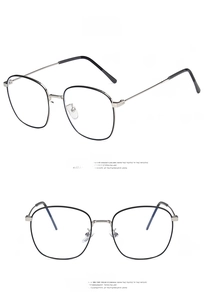 Detailed views of retro silver and black polygonal glasses frames with metal temples