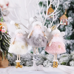 Three plush Christmas angel ornaments in white, grey, and pink hanging on a white branch