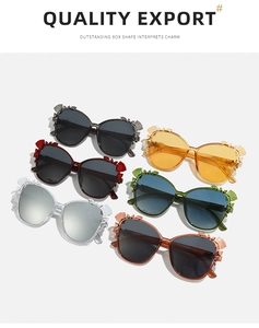 Detail of oversized floral sunglasses in six colors with decorative 3D petals on frames