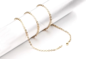 Detailed view of a gold-plated stainless steel cable chain with a secure lobster clasp