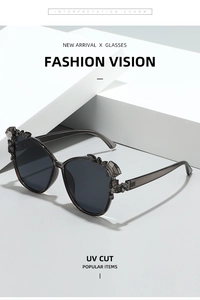 Detail of black oversized sunglasses with faceted crystal accents and UV protection