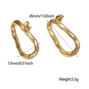 Detailed view of irregular hammered gold titanium steel stud earrings with size measurements