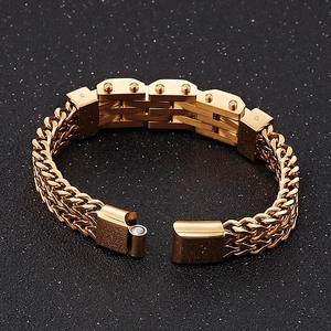 Detailed macro view of gold-plated woven chain bracelet with secure magnetic clasp