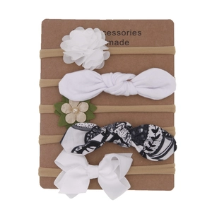 Set of 5 soft nylon baby headbands with flowers and bows on display card