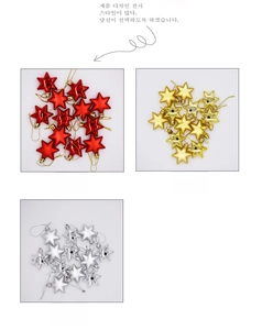 Close-up of shiny electroplated star Christmas ornaments in red, gold, and silver finishes