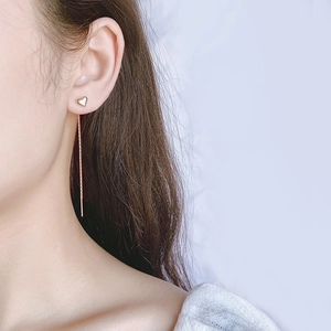 Elegant S925 silver heart tassel ear threaders in gold plating shown on a model