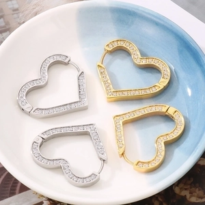 Elegant gold and silver titanium steel heart earrings with micro-inlaid cubic zirconia