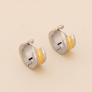 Detail view of two-tone gold and silver stainless steel hoops with brushed finish