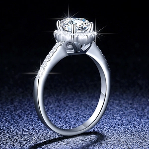 Close-up of S925 silver ring featuring side view heart carvings and brilliant moissanite