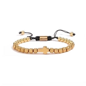 Adjustable black woven bracelet with gold cross pendant and metallic pineapple beads
