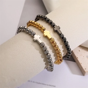 Vintage cross bead bracelets in gold, silver and black metal with knurled texture