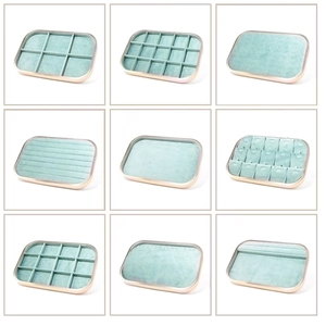 Detail view of microfiber jewelry trays in mint green with various compartment layouts