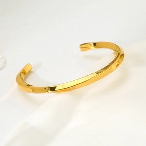 Minimalist 18k gold plated stainless steel twisted cuff bracelet with glossy finish