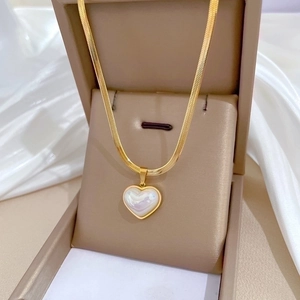 Gold-tone titanium snake chain necklace with a pearlescent heart pendant for women