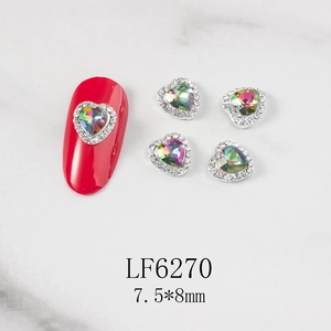 Detailed macro view of 7.5x8mm AB heart-shaped nail charms with elegant silver frames