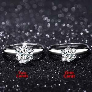 Comparison of 1 carat and 2 carat classic six-prong solitaire rings on black background