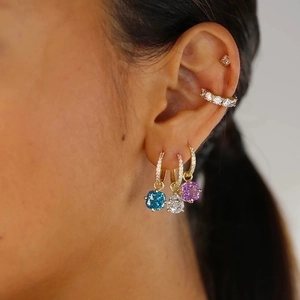 Close-up of S925 silver hoop earrings with cushion-cut blue, white and purple zircon stones